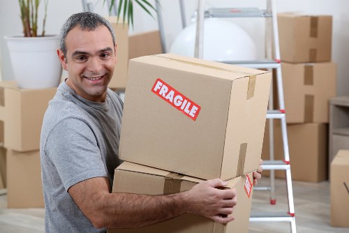 Movers team preparing household items for a scheduled service