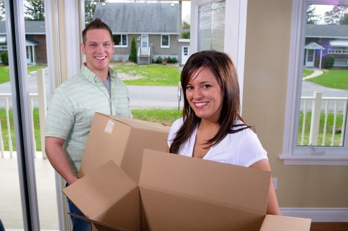 Movers preparing equipment safely before a home move