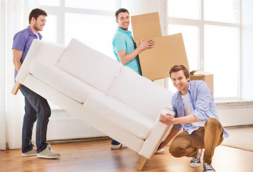 Man and van moving furniture through a Wandsworth residential street