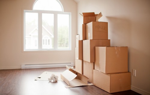 Careful wrapping and boxing of fragile belongings for a move