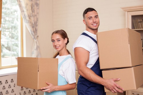 Van service helping with furniture transport in a Wandsworth residential street