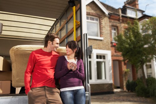 Professional Wandsworth movers organizing fragile items for transport